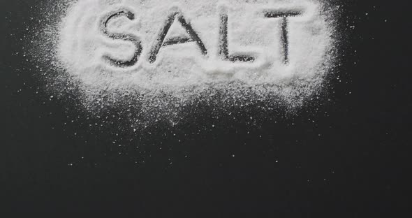 Animation of salt text written in salt on black background