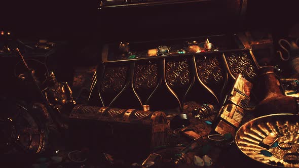 Treasures in a Dark Cave with Coins Diamonds and Gold