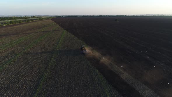 Tractor Plows the Ground