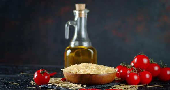 Pasta Dry Vermicelli with Tomatoes and Oil Slowly Rotates. 