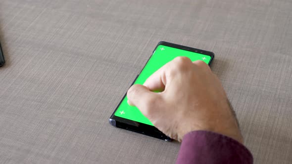 Male Hand on the Table Touching a Green Screen Chroma Mock Up