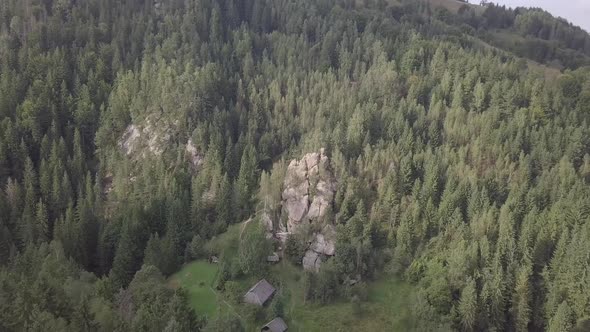 Stone rocks Ternoshorska Lada amidst beautiful scenic Carpathian forests, Ukraine