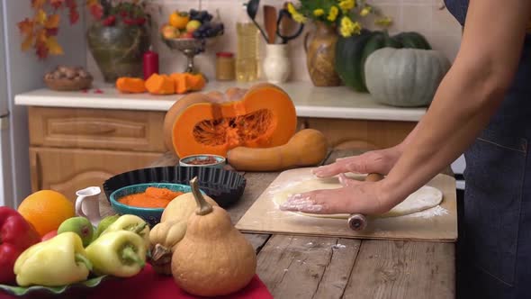 A Woman Bakes Pumpkin Pie