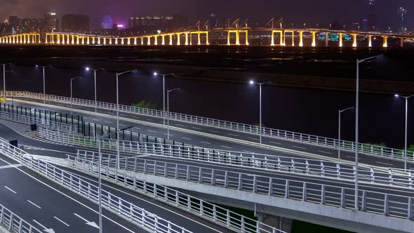 Macau Bridge Traffic Cityscape Night Timelapse Pan Up