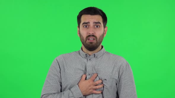 Portrait of Brunette Guy with Fear and Horror Looking Forward. Green Screen