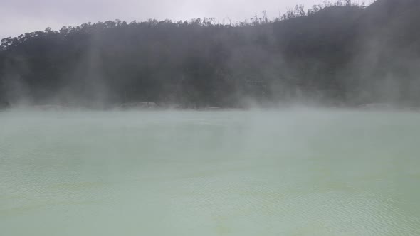 Aerial view fly through smoky in white crater, bandung, Indonesia