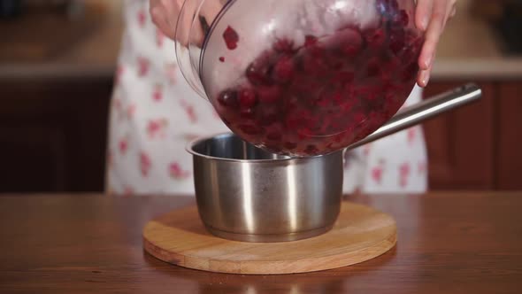 Close Up Shot of the Pan, Where the Cook Puts Fruit From a Glass Plate