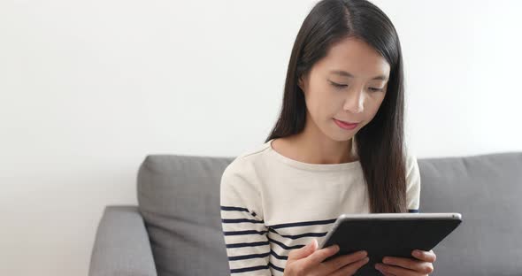 Woman Watching on Tablet Computer