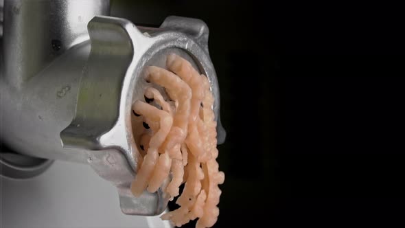 Cooking Minced Meat on an Electric Meat Grinder From Meat Closeup