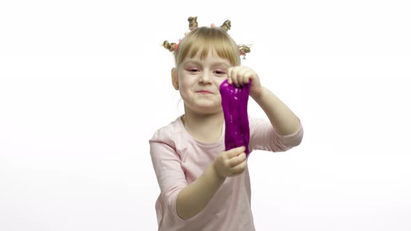 Kid Playing with Hand Made Toy Slime. Child Having Fun Making Purple Slime