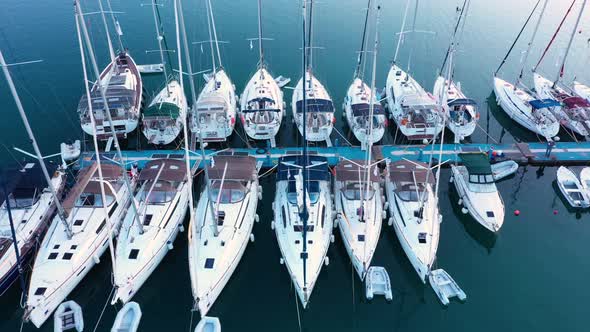 Top down view of yachts in the marina. Sailboats and regular Boats moured