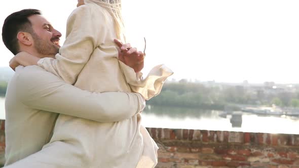 Beautiful Couple in Love Hugging and Smiling Outdoor