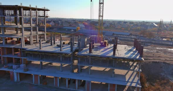 A Multistorey Apartment Building is Being Constructed Using Tower Cranes That Can Reach Heights As