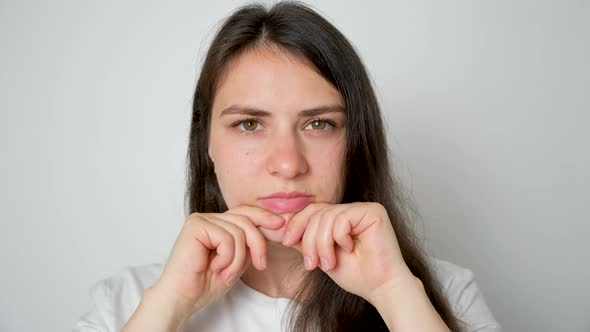 A Woman with Temporomandibular Joint Dysfunction Performs Exercises to Strengthen the Joint