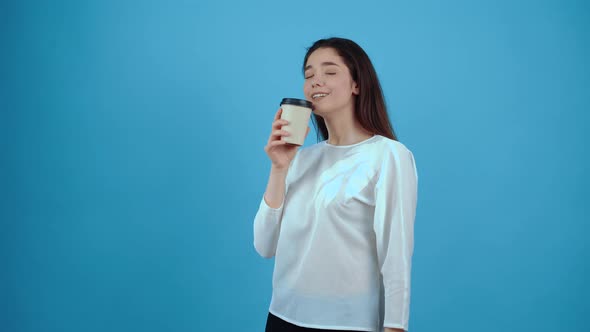 The Charismatic Girl Drinks Coffee and Feels Overloaded with Energy