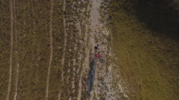 Drone view of two friends hiking in the Apennines, Umbria, Italy