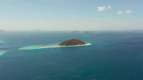 Small Torpic Island with a White Sandy Beach, Top View.