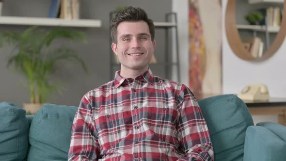 Portrait of Man Smiling at the Camera Sofa