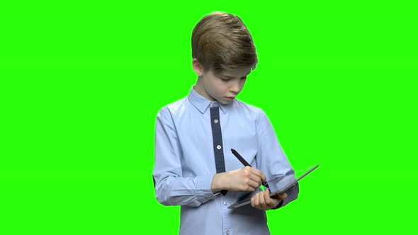 Portrait of Smart Boy Drawing on Tablet Pc