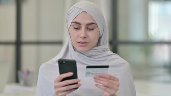 Young Arab Woman with Successful Online Shopping on Smartphone