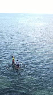 Boat Boats in the Ocean Near the Coast of Zanzibar Tanzania Slow Motion Vertical Video