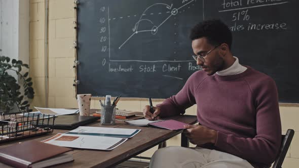 Finance Teacher Posing at Table