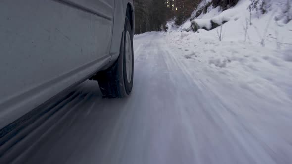 Car Wheel While On Snow Road