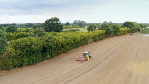 Aerial view of an agriculture field with tractor