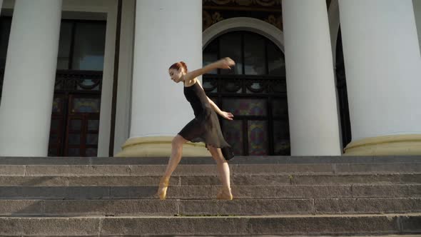 Wide Shot of Slim Gorgeous Woman in Black Dress and Yellow Pointes Bending and Moving Standing on