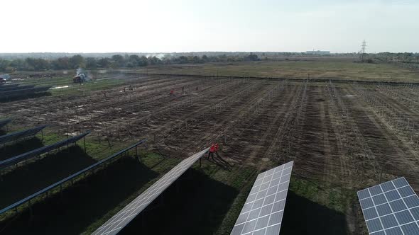 Aerial View of the Field with Rows of Solar Panels and the Mounting Racks