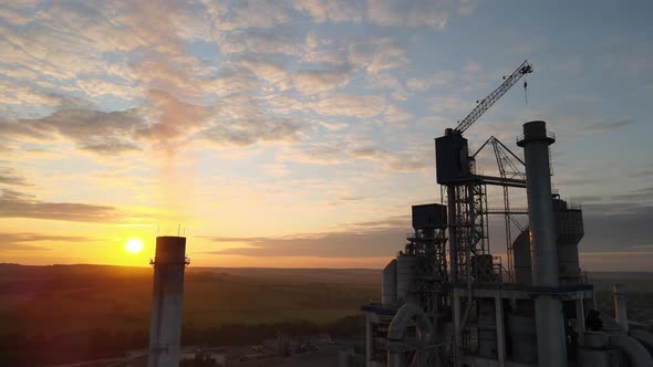 Aerial View of Cement Factory with High Concrete Plant Structure and Tower Crane at Industrial