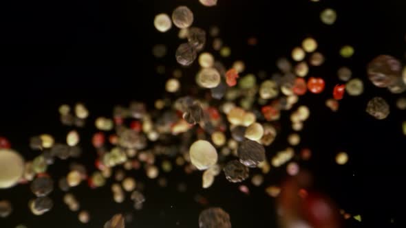 Super Slow Motion Detail Shot of Color Pepper Flying Towards Camera at 1000Fps