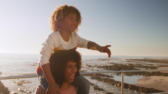 Mother and son pointing away