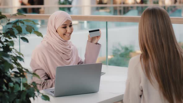 Muslim Financial Advisor Banking Worker Giving Credit Card Unrecognizable Girl Client Signs Contract