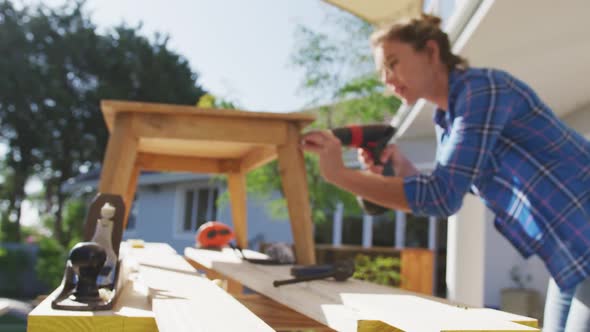 Woman in self isolation in quarantine during coronavirus pandemic does outdoor work