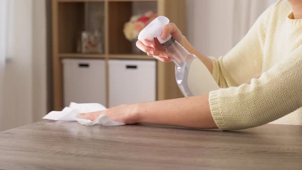 Close Up of Woman Cleaning Table at Home