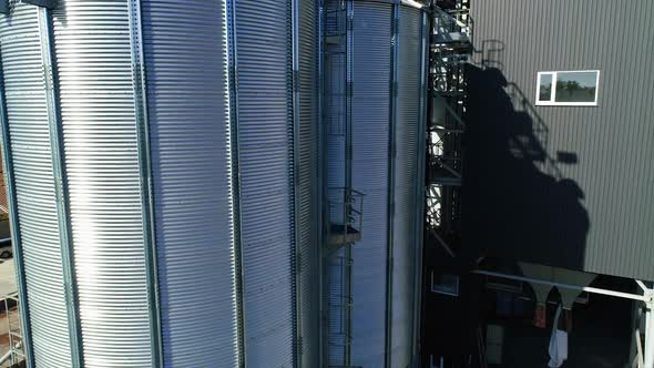 Grain elevator. Metal grain elevator in agricultural zone. Aerial view.