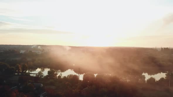 smoke are enveloping a river as a result of a fire after a drought