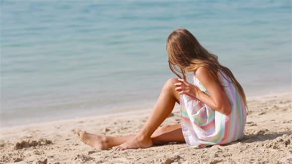 Happy Girl Enjoy Summer Vacation on the Beach