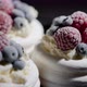 Delicious Mini Pavlova Meringue Desserts Served with Frozen Frosty Berries - VideoHive Item for Sale