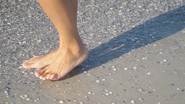 Female Feet Walking on Water