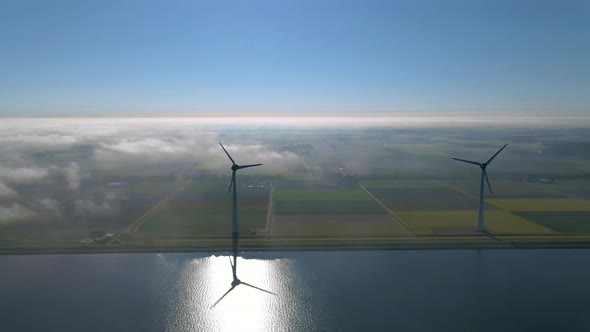 Wind Turbines in the Early Morning Wind Mill Park in the Netherlands