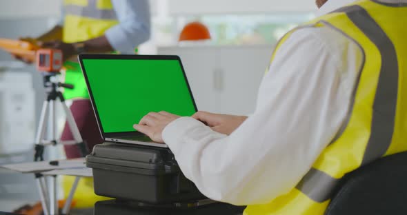 Cropped Shot of Surveyor Engineer Working on Laptop in Office