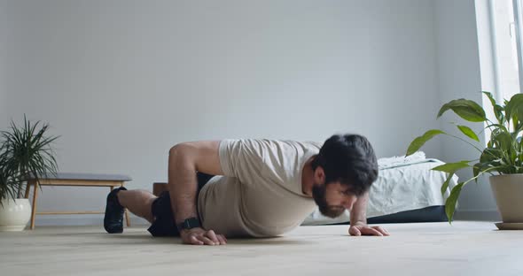 Bearded Guy Doing Push Ups in Bedroom at Home