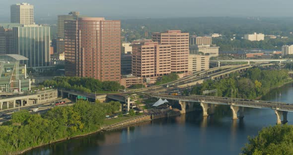 High-rise buildings and traffic moving on bridge over river in Hartford