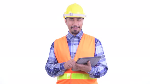 Happy Bearded Persian Man Construction Worker Talking While Using Digital Tablet