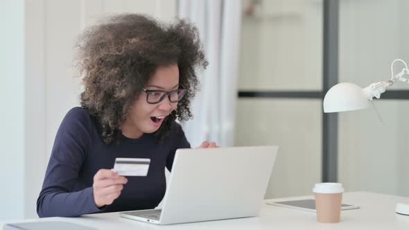 Successful Online Shopping on Laptop By African Woman