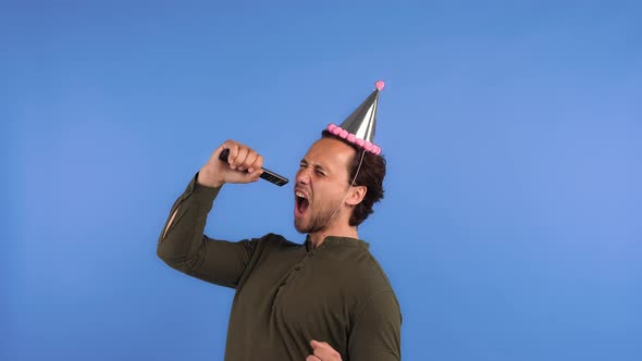 Male in Party Hat and Dark Shirt