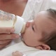 Mother Bottle Feeding Baby Girl - VideoHive Item for Sale