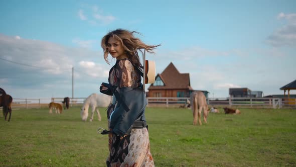 Happy Woman Running in Paddock on Farm